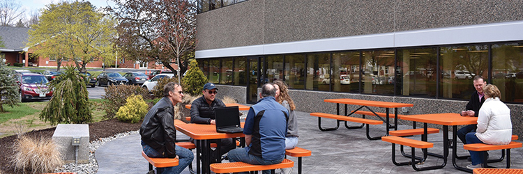 TFMoran Landscape Architects designs outdoor space for Sunrise Labs with property manager Riley Enterprises and contractor JET Concrete 
